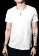 Аяз Гайнеев in a casual white t-shirt, showcasing his arm tattoo and stylish accessories, exuding confidence and charisma.