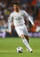 Cristiano Ronaldo in action for Real Madrid during a Champions League match, showcasing his soccer skills and athleticism.