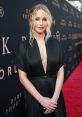 Jennifer Lawrence stunning in a black gown at the "Dark Phoenix" premiere, showcasing her elegant style and radiant beauty.