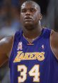 Shaquille O'Neal, Los Angeles Lakers jersey, intense game moment, focused expression, showcasing athleticism and determination.