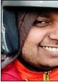 Smiling individual in a helmet, representing the humorous spirit often found in Indian memes.