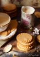 Delicious buttery cookies stacked beside a cup of tea, creating a cozy, inviting afternoon tea scene. Enjoy with friends!