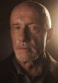 Mike Ehrmantraut's intense gaze highlights his complex character in the series, embodying the essence of a seasoned fixer.