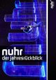 nuhr der jahresrückblick stage with vibrant blue lighting and performer, highlighting contemporary comedy entertainment.