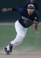 Alex Robles fields a ground ball during a baseball game, showcasing athleticism and precision on the field.