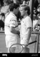 Intense moment between two tennis players during a match, showcasing the competitive spirit and tension of the game.