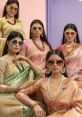 Elegant women in stylish sarees and sunglasses showcase traditional fashion with modern accessories, perfect for Sanidhya Single.