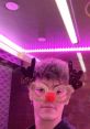 ZachOfHeartz festive look with reindeer glasses and colorful neon lights, embodying playful holiday spirit.