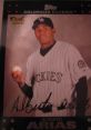 Alberto Arias rookie card featuring the Colorado Rockies, showcasing his signature and professional baseball attire.