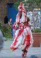 Traditional Balasasirekha FSN dancer in vibrant red and white costume, showcasing cultural heritage and lively performance.