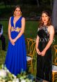 Elegant women in evening gowns stand in a garden setting, showcasing luxury and style at a glamorous event.