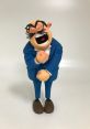 Cheerful cartoon character in a blue suit with exaggerated features and a big smile, representing humor and joy.