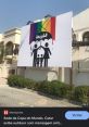 Outdoor advertisement in Qatar displaying a provocative design with rainbow colors, criticizing current societal norms.