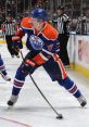 Edmonton Oilers player #4 skating on the ice during an NHL game, showcasing agility and skills in professional hockey action.