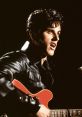 Rock musician performing passionately in a leather jacket with a red guitar, showcasing vintage style and charisma.