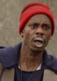 Dave Chappelle performing a memorable sketch on "Chappelle's Show," showcasing his iconic comedic style and expressions.