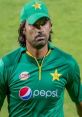 Muhammad Irfan Asmawi in Pakistan cricket jersey, showcasing team spirit during a match with a focused expression.