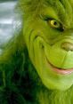 Grinch character with mischievous smile and vibrant green fur, embodying holiday mischief and transformation themes.