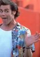 Jim Carrey as Ace Ventura, showcasing a playful expression with a vibrant Hawaiian shirt against a bright background.