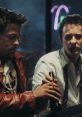 Tyler Durden and the narrator share a moment, embodying the gritty essence of "Fight Club" with tension and camaraderie.