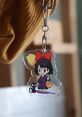 Kiki Canta keychain featuring Kiki with a broom and her cat, showcasing a cute and colorful design for fans.