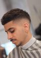 Ninja low tapered fade The of a razor buzzing fills the air as the barber meticulously shapes the Ninja low tapered fade.