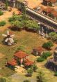 Peaceful village scene from Age of Empires 2, featuring lush farmland, a windmill, and a fortified wall.