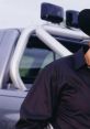 Texas Ranger in a black shirt poses next to a rugged vehicle, highlighting the action-packed essence of Walker Texas Ranger.