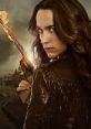 Wynonna Earp wields a flaming gun, showcasing her fierce determination and iconic style in a gritty, supernatural landscape.