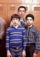 Three boys in front of school lockers, showcasing a classic moment from "Freaks and Geeks," capturing teenage awkwardness.