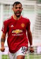 Bruno Fernandes celebrates passionately in his Manchester United jersey, showcasing his fierce determination on the field.