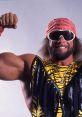 Macho Man Randy Savage flexes his muscles, showcasing his signature vibrant attire and iconic sunglasses.