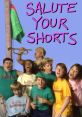 Cast of Salute Your Shorts joyfully singing at camp, showcasing vibrant shirts and a playful atmosphere.