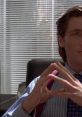 Patrick Bateman in an office setting, portraying a confident and calculated demeanor with a professional look.