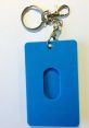 Blue silicone keychain holder with key ring and clip, ideal for secure access to OV-HOES related items.