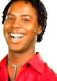 Cheerful man wearing a red shirt and silver jewelry, showcasing a bright smile against a white background. Samwell vibes.