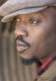 Close-up portrait of Anthony Hamilton showcasing his distinctive style and thoughtful expression.