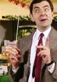 Mr. Bean humorously gestures with a stick in a market, showcasing his iconic comedic style and quirky personality.