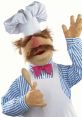 The Swedish Chef cheerfully waves while holding a wooden spoon, showcasing his fun cooking style with a whimsical expression.