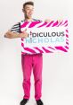 Man holding a colorful sign that reads "Ridiculous Nicholas," showcasing a fun and playful expression.