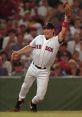 David Naehring celebrates a play on the field wearing a Red Sox jersey, surrounded by an enthusiastic crowd.