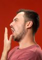 Man yawning and looking bored against a red background, expressing feelings of tiredness and lack of engagement.