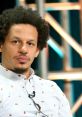 Eric Andre at a panel discussion, showcasing his unique style and thoughtful expression. Known for innovative comedy.