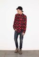 Model showcasing bold ASOS Menswear style in a red star-patterned shirt, distressed jeans, and trendy leopard print shoes.