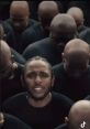 Kendrick Lamar performs with a crowd of hooded figures, reflecting themes from "if we being real yeat" in a powerful visual.