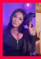 TikTok Lady gaming with a controller, wearing headphones in a stylish black outfit, showcasing her gamer girl vibe.