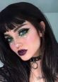 E-girl style featuring bold green eyeliner, dark lipstick, and a choker, embodying the edgy aesthetic of E Girl V2.