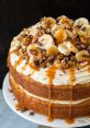 Delicious banana cake layered with creamy frosting, topped with fresh bananas, chocolate shavings, and caramel drizzle.