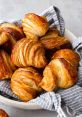 CROISANT-_- The of a croissant being freshly baked in the oven is a symphony of crackling and sizzling. The butter within