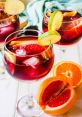 Refreshing Tinto de Verano cocktail garnished with fresh citrus slices and ice, perfect for summer gatherings.